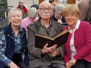 photograph of Huyton U3A members with the diary